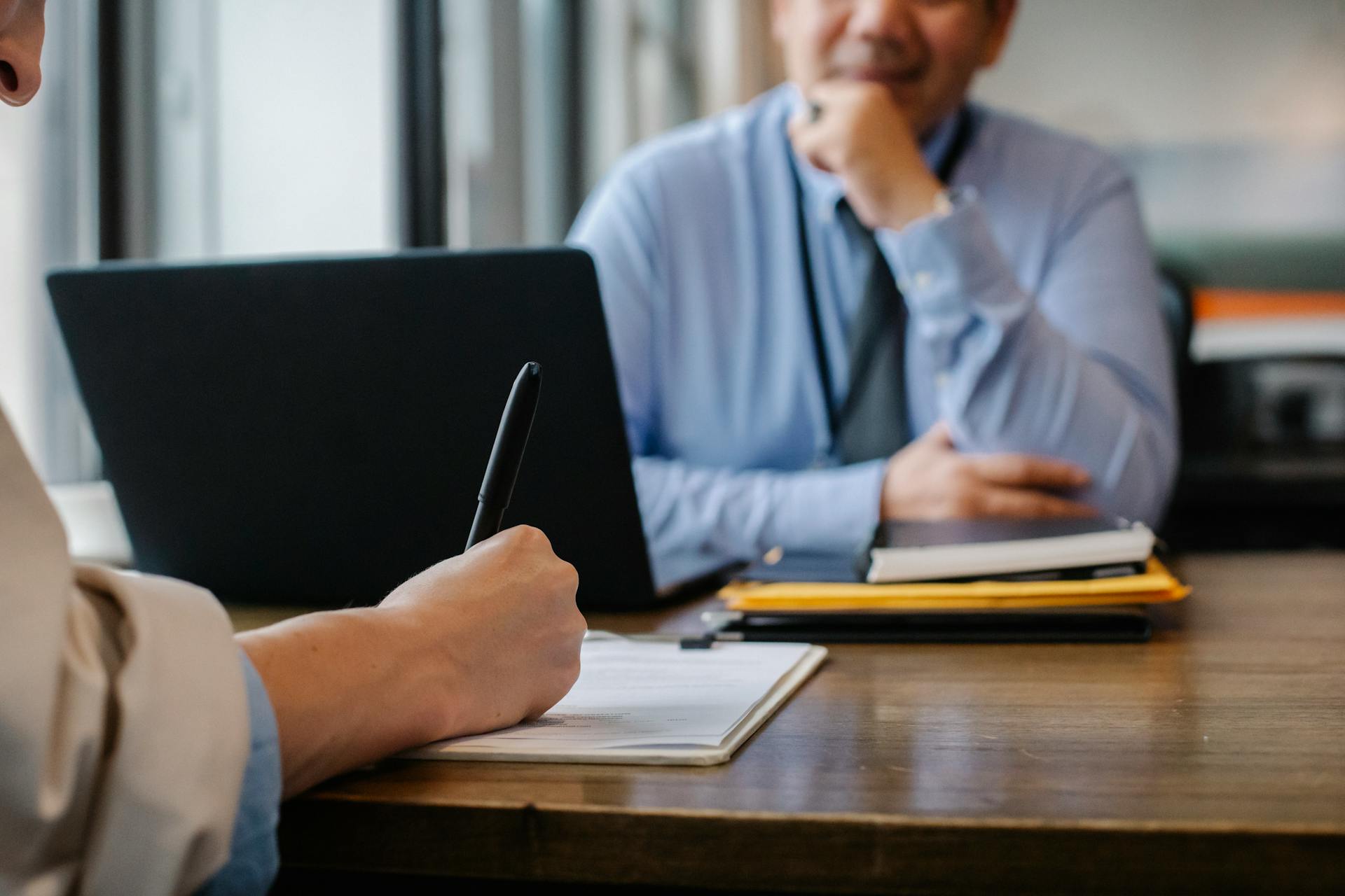 Professional NAATI certified translator working on document translations at their desk